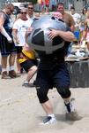 How far can you carry a bag of sand (while walking in the sand?)