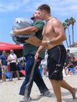 Justin Hunter is in the moment lugging a 250-pound bag of sand across the beach.