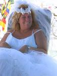 The bride (Anne Blunden) was wed to her groom in a secret ceremony in Las Vegas on June 17, 2006.  But at Burning Man, she slips into a wedding gown for the first time. 