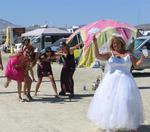 All the bridesmaids line up in hopes of catching the bridal bouquet.