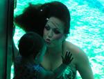Mermaid Marci sends her daughter a kiss. *Photo by John Athanason. 
