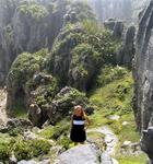 Cherie enveloped by the misty limestone.