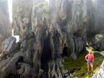 Marjo is dwarfed by slabs of ribbed limestone.