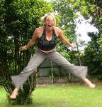 Marjo bounces on the trampoline in back of our hostel.