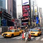 Cyclists and cars share the streets of New York.