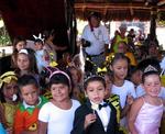 A parade of kindergarteners stroll through the restaurant thanking the patrons for their generous donations to their school.