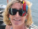 Caren darns the parrot glasses.