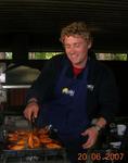 Dion, the SuperCook, prepares the chicken. *Photo by Desiree.