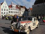 Cherie by a car in the Peking to Paris race.