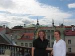 Cherie and Brenda have lunch on a terrace overlooking the city.