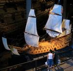 Tourists admire a replica of the warship Vasa complete with her sails.