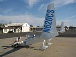 Greg makes flight plans on the canard of his "experimental" Long-EZ.