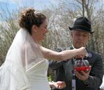The couple stirs the liquid until a chemical reaction takes place causing the substance to bubble.