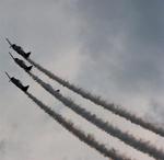 The AeroShell Aerobatic Team is comprised of pilots: Alan Henley, Mark Henley, Steve Gustafson, and Gene McNeery.