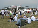 Spectators watch the planes roll in.