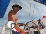 Bill Lilly at the helm of Moontide.
