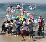 Friends gather around the panga.  The excitement is contagious.