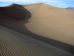 The sand sings as is slides down the dune.