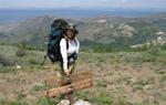 Cherie by the Ruby Crest Trail sign.  