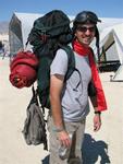 Greg lands his plane in the Black Rock Desert and then "backpacks" to camp.