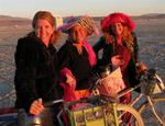 Jean, Lisa and Cherie bask in the early playa light.