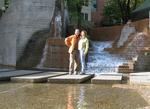 Cherie and Greg by a fountain in Portland.