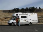 Cherie and Greg by Mookie, the RV.