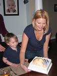 Jet and Kristi present the cake.