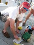 Cutting up bananas for the daiquiris on the dock.