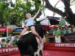 Riding the mechanical bull at Cowboy Bills.