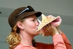 Cherie blowing a conch shell (sans mollusk) at the 2009 Conch Honk in Key West. *Photo by Regina Lee.