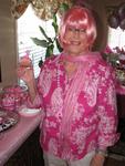 Mom holds a pink ribbon cupcake.